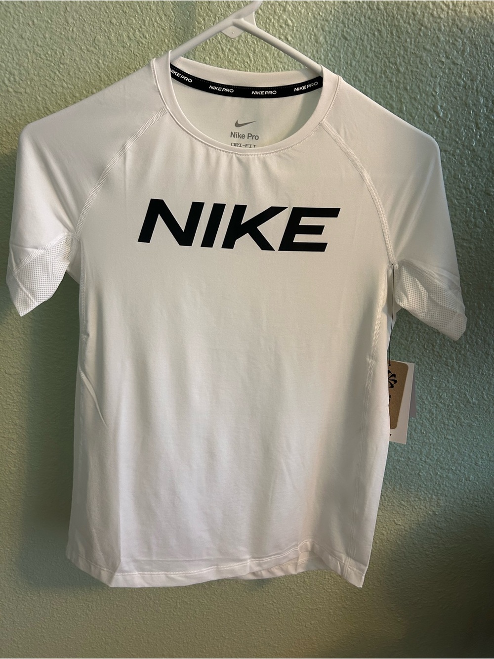 Nike girl while Short-Sleeve Performance Tee with Black Logo.Size large